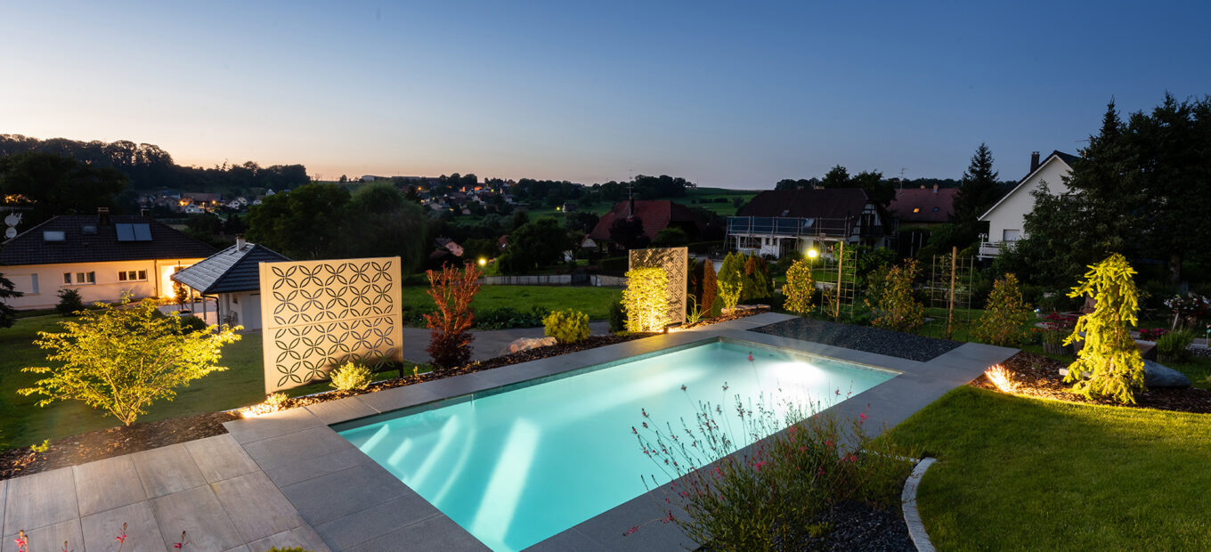 rectangular pool with dark liner at night